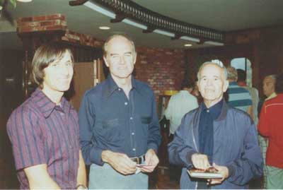 Kenneth Norton, Senator George McGovern, and William Hermanns, Santa 